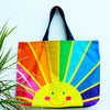 Happy face oversized beach bag holdall in rainbow sunrise print.